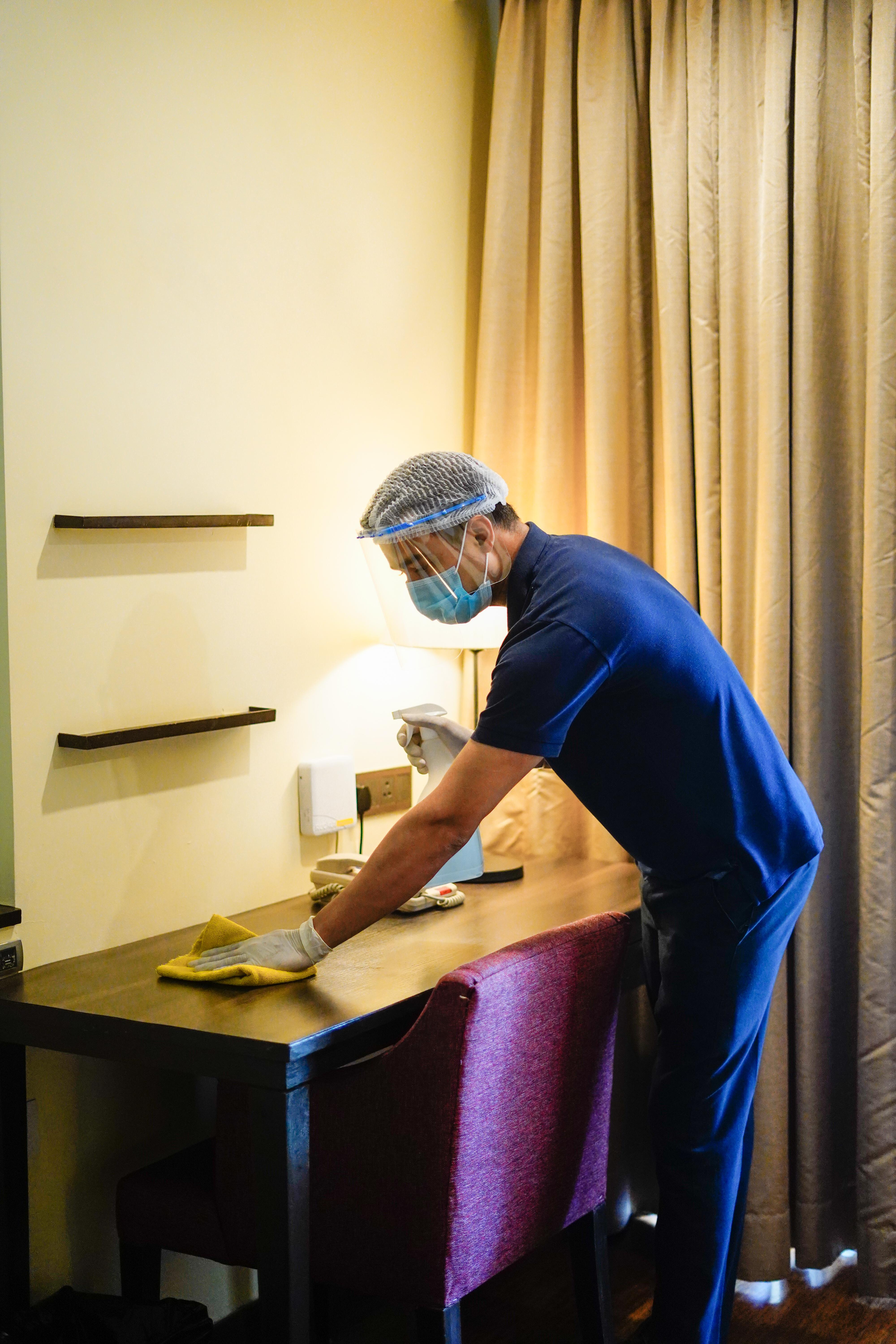 Novotel Goa Resort & Spa Candolim Eksteriør bilde A hotel housekeeper wearing a face shield and gloves